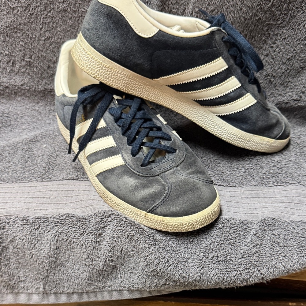 Women’s blue/ white suede Adidas tennis shoes. Size 6.5 and preowned.